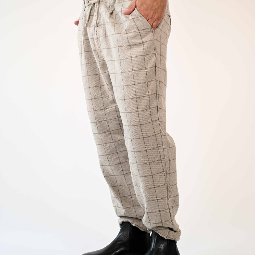 
                      
                        PANTALONE LOOSE SCOZZESE CON COULISSE IN FLANELLA BEIGE
                      
                    